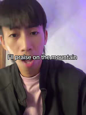 A selfie-style video cover. The creator is an Asian man facing towards the camera. The background is softly lit with a purple hue. The main visual element is a text overlay towards the bottom of the screen.