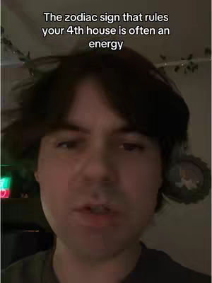 A close-up shot of a young man looking at the camera and talking. Text overlayed at the top of the frame.