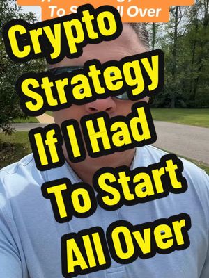 A man in sunglasses stands outdoors with text overlay in yellow boxes that says "Crypto Strategy If I Had To Start All Over". The background appears to be a park or residential area with greenery.