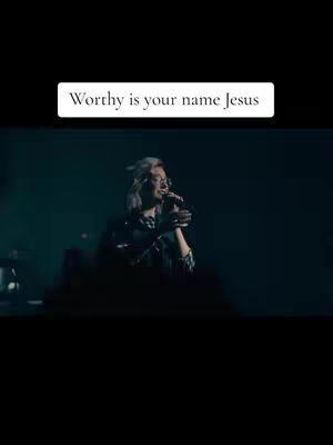 The cover image shows a woman with light hair singing into a microphone on a stage. A white rectangle with the text 'Worthy is your name Jesus' is at the top.