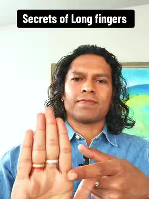 A man with dark curly hair is the central focus, positioned in front of what appears to be a home setting. He is wearing a casual blue shirt and has a neutral expression. In the foreground, his hand is prominently displayed to represent the context of the image and a sign about Secrets Of Long fingers