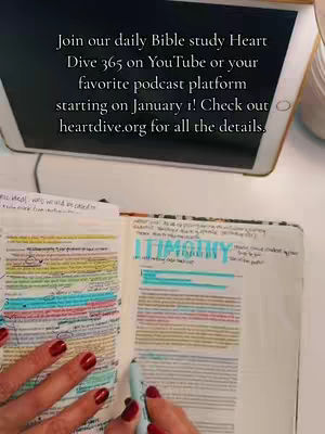 The image shows an open bible with annotations and highlighted text and a hand writing on the pages. Above is a tablet showing the additional text for the video description.