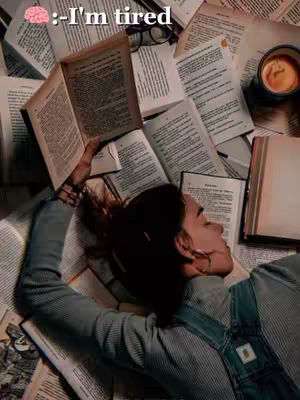 A person with dark hair lies exhausted among a pile of books with open pages. A cup of coffee sits nearby, suggesting prolonged study. Text overlays read "I'm tired" and a brain emoji.