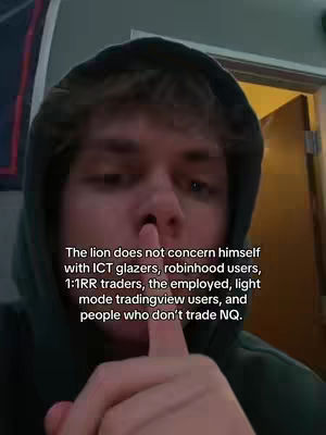 A young man with light brown hair and a green hoodie is shown in a selfie-style shot. The image is framed from the chest up, prominently focusing on the face of the individual. The background is slightly blurred, suggesting an indoor setting. The man has his index finger pressed against his lips in a gesture of silence. The image is well-lit, and the color tones are neutral. Text is overlaid, in a white font, describing the statement about the lion.