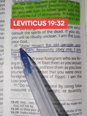A close-up image of an open book with text highlighted and a red rectangle overlayed on top. A pen points at the text.
