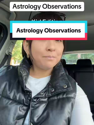 A woman is sitting in a car. She is wearing a black vest over a white t-shirt. There is text overlaid on the image, with a white bar at the top and a teal bar in the middle. The background shows the car's interior.