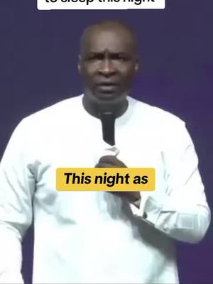 A man in a white shirt stands against a dark background, holding a microphone. Text overlays highlight the video's message near the bottom.