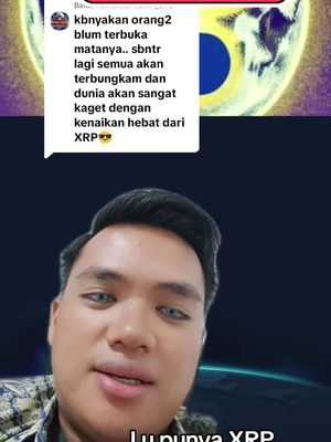 The cover image displays a man in the foreground against a dark, space-like background. The man is positioned from the chest up, with a neutral expression. In the upper portion of the image, there is a comment notification overlay. Below the man's face, some text is overlaid, reading "Lu punya XRP". The color palette is muted, with the man dressed in a printed shirt with a neutral lighting. The background is dark, creating contrast with his face.