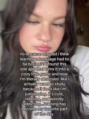 A young woman with long, dark hair and visible blush is looking down and slightly to the left, with closed eyes. Overlaid on the image is text in a sans-serif font, detailing the creator's positive experience with a language-learning app.
