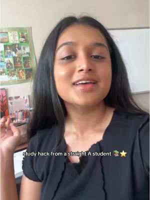A person with long, dark hair is centered in the frame, looking towards the viewer with an open mouth, suggesting speech. The background includes a cluttered wall with colorful items and a whiteboard. Text overlaid on the image includes 'Study hack from a straight A student' and a star and books emoji.