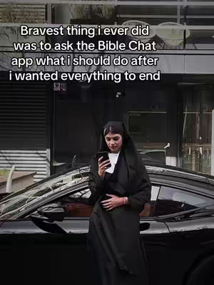 A woman dressed as a nun stands next to a black car. The woman is looking at her phone. Text is overlaid on the top of the image with the video's hook.