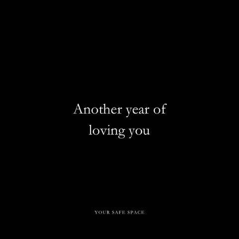 A minimalist image with a stark black background. Centered is white text that reads, "Another year of loving you." Below this, also in white, is smaller text: "YOUR SAFE SPACE."