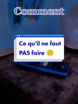 The image is a screenshot from a mobile app, presented vertically. The background is a blurry, dark, medium-toned brown, perhaps a wooden surface. The core of the image's composition centers on a white box containing text. The text, in a bold, sans-serif font on a blue background, says 'Ce qu'il ne faut PAS faire” with a yellow smiley face at the end. Above this is another text overlay in a rounded blue box with the word 'Comment'. Overall, the image uses a direct, simple design to highlight its message with minimalist aesthetic.