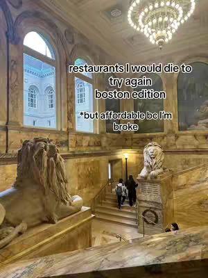The cover image shows a grand interior space, likely a library or museum, with high arched windows and a large chandelier. There are stone lion statues and people are visible walking the main entrance/stairs of the building.