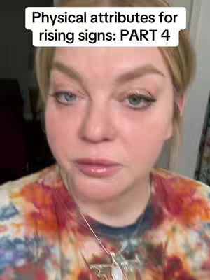 A close-up shot of a woman with blonde hair looking at the camera. Above her is a white box with text. She is wearing a patterned shirt and a necklace.