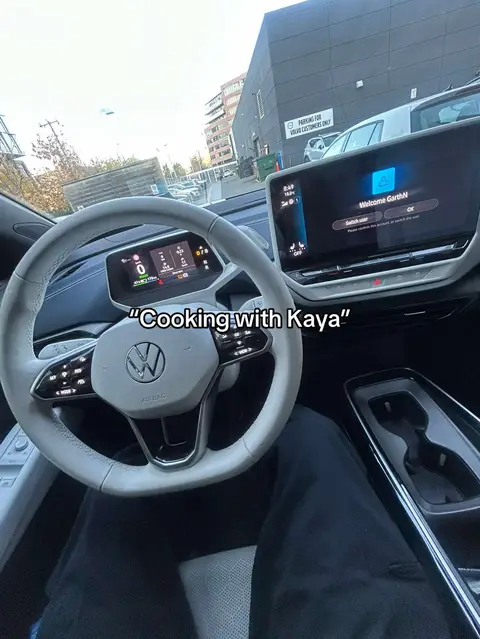 The cover image is a first-person view from inside a car, focusing on the steering wheel and dashboard. A smartphone is mounted on the center console. The color palette includes whites, blacks, and grays.
