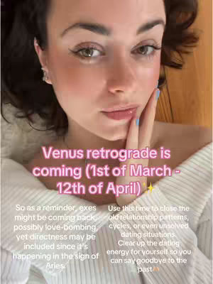 A close-up selfie shows a woman with brown hair and brown eyes. She's touching her face with a hand, and text overlays describe astrological events in a soft, pink font. The background is blurred, suggesting an indoor setting. The composition is balanced, with soft lighting enhancing the subject's features.