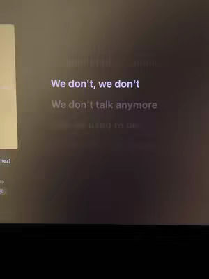 The cover image is a dark screen. In the center, there is white text overlayed. The text looks like song lyrics. The background looks like a screen capture from a app with some blurred elements.