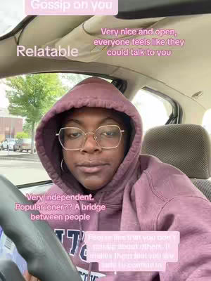 A person wearing glasses and a hoodie is seated inside of a car, facing the camera. Text overlays of various colors create a collage on the image.