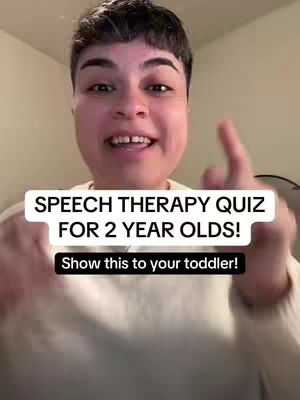 A woman with short hair smiles directly at the camera, positioned in front of a white wall. Overlayed text indicates the video's topic.