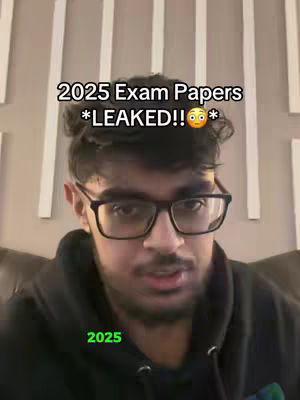 A selfie-style video cover with a young man as the main subject, centered in the frame looking towards the camera. He has dark hair, glasses, and a beard. Overlaid text announces "2025 Exam Papers *LEAKED!!*" with an emoji. Additional green text appears below.