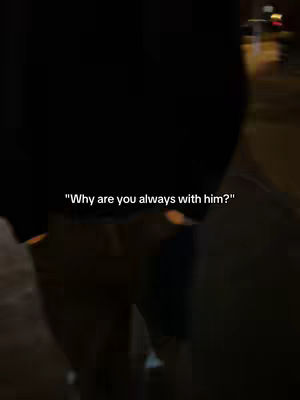 A blurry shot of a person walking in the dark, with only the lower body and back visible. There is text overlayed on the image.