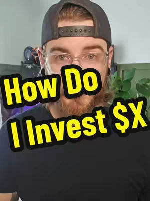 A close-up shot features a man with a beard and glasses. Overlaid on the image are text blocks in yellow with a black border. The text reads, 'How Do', on top and 'I Invest $X' below it. The man is wearing a dark baseball cap and a black t-shirt, with body art visible on his ear.