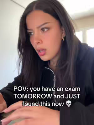 A young woman looks anxiously at a laptop screen, framed from the shoulders up. She has dark hair, a neutral expression, and a slight open-mouthed pose. Text overlaid on the image reads: 'POV: you have an exam TOMORROW and JUST found this now'. A skull emoji is positioned to the right of the text.