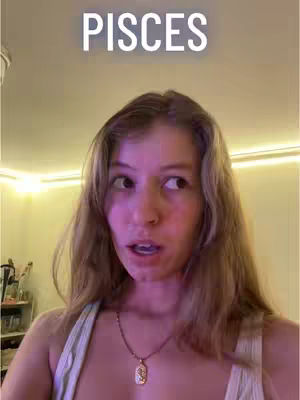 A woman gazes slightly to her right with a look of surprise and subtle humor, against a background of a light-filled room, with the text "PISCES" above her. She is wearing a casual top with a necklace.