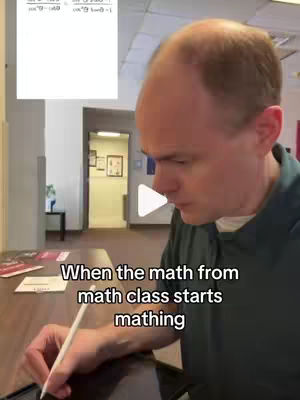 A man is bent over a desk, holding a stylus and drawing on an electronic pad, with a math problem displayed graphically behind him. Text is overlaid at the bottom, and the background suggests an office or classroom.