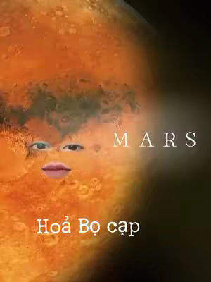 The cover image features a digitally altered image of the planet Mars. The planet's surface is used as a backdrop, and a face has been superimposed onto the planet's surface, with eyes and lips. The words "MARS" are written in white capital letters on the right side, and the Vietnamese phrase "Hỏa Bọ cạp" is written at the bottom. The background transitions from orange to dark black, suggesting a cosmic setting.