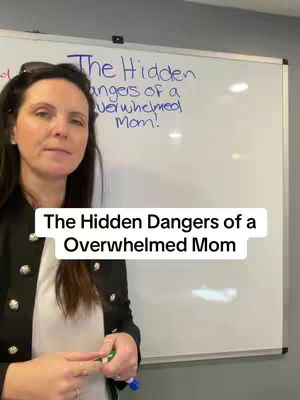 A woman stands in front of a whiteboard. A title overlay reads, 'The Hidden Dangers of a Overwhelmed Mom'.