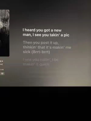 The cover image shows lyrics of a song with the Spotify app interface in the background. The text is in white and is centered. The background is a dark grey.