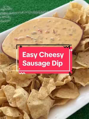 The cover image features a white rectangular dish filled with a creamy, light-orange cheesy sausage dip. Around the dip are golden-brown tortilla chips. A bright red rectangle frames the words "Easy Cheesy Sausage Dip" in white font.