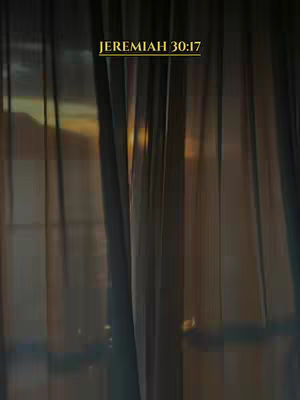 An image of a window with sheer curtains, sunlight shining through creating a gradient effect, with text overlay in gold.