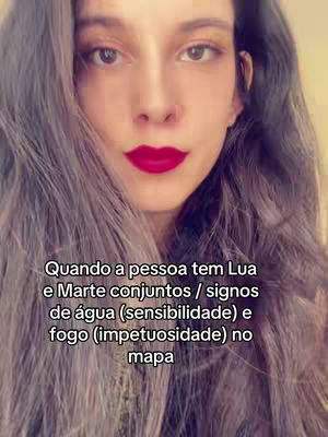 A woman with long brown hair and red lipstick looks directly at the camera. Text is overlaid on the image.
