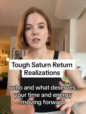 A woman with medium-length brown hair and a concerned expression is centered in the frame. She wears a black tank top, and the background includes a room with several framed pictures, a light, and hints of domestic decor. Two lines of white text appear across the screen, explaining the video's topic.