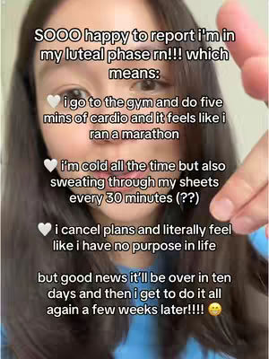 A selfie-style image featuring a light-skinned woman. The woman's face is centered, captured from the chest up. She has long dark hair that partially obscures her shoulders. She is slightly angled to the right, and her facial expression suggests a mix of tiredness and amusement. Her right hand is in the frame, with a finger pointing down towards text. The background is plain, making the woman the focus. Text overlays are used to describe the phases of Luteal cycle.