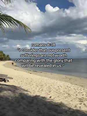 A serene beach scene with white sand, a clear blue sky filled with fluffy white clouds. The image has added text overlay with a bible verse.
