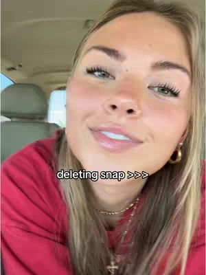 A young woman with long blonde hair and a red top is looking at the camera with a slight smile. Text overlay reads, "deleting snap >>>". She's in a car, with a seat and headrest visible in the background.