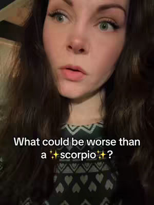 A woman with long brown hair and green eyes looks directly at the camera with a slightly surprised expression. Text overlayed on the image asks a question about astrology.