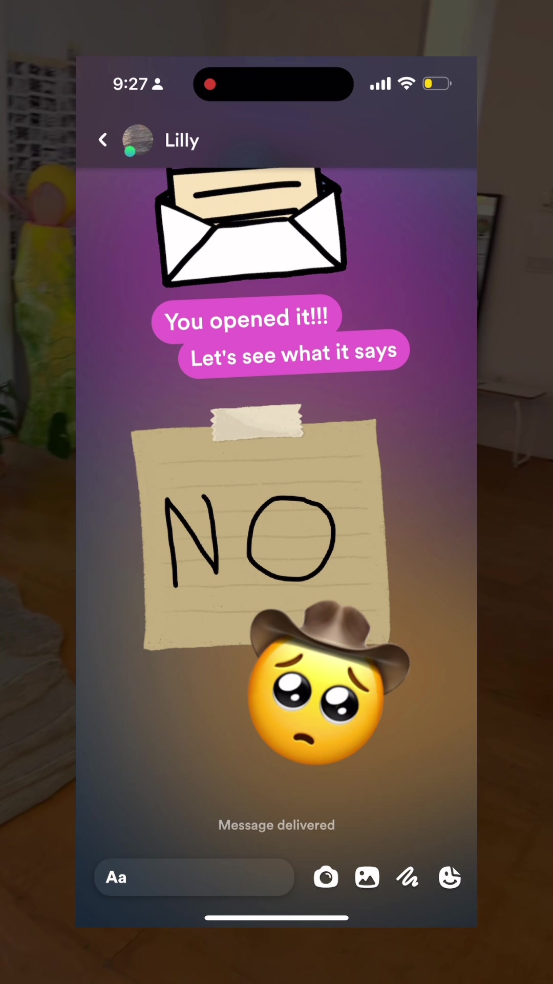 The cover image shows a mock-up of a message conversation. The interface is set against a gradient purple background. In the center is a tan sticky note with the hand-written word "NO" in dark ink. Below the note is a sad emoji wearing a cowboy hat. Above the note are two speech bubbles with the text "You opened it!!!" and “Let's see what it says”. At the top of the screen is a record icon and user name, and at the bottom are the standard message options. 