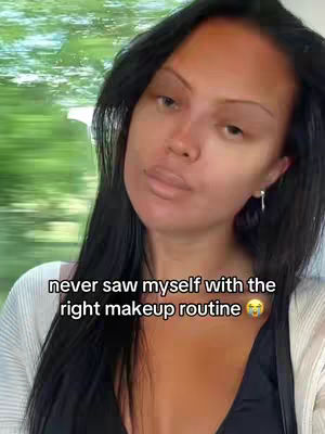 The cover image presents a woman in a selfie-style shot, looking slightly upwards. The background is blurred, with hints of green suggesting an outdoor setting, possibly from a window or balcony. The woman has dark hair and is wearing a neutral-colored top, possibly a sweater or cardigan. Her expression is soft and neutral, with her lips slightly parted. Text overlay near the bottom highlights the video's theme.