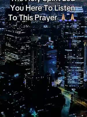 A nighttime cityscape with tall buildings and illuminated windows. Text overlays are present, along with a praying hands emoji.