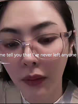 The close-up shot features a person, positioned at the center, wearing glasses. The individual's face takes up most of the frame. The person has a neutral expression and slightly parted lips. The background appears blurred with soft lighting. Overlayed at the bottom of the image is white text that states "Let me tell you that I've never left anyone".