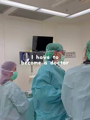 The cover image shows a brightly lit operating room with several medical professionals wearing surgical attire. In the foreground, a person wearing a surgical cap and mask is positioned, with another person beside them, also in surgical attire and a mask. Text overlayed on the image reads 'I have to become a doctor'.