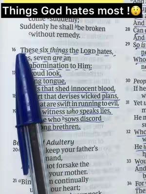 A book with highlighted text and a blue pen positioned over it. The text displays multiple lines from a scripture.