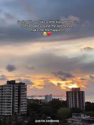 The image features a sunset over a cityscape. The sky is filled with a mix of orange, yellow, and purple hues, with clouds scattered throughout. Below, the silhouette of buildings are visible. The video hook text is overlaid on the image.
