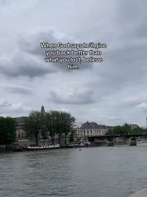 A scenic view of a river with buildings in the background and the quote overlaid. The sky is overcast.