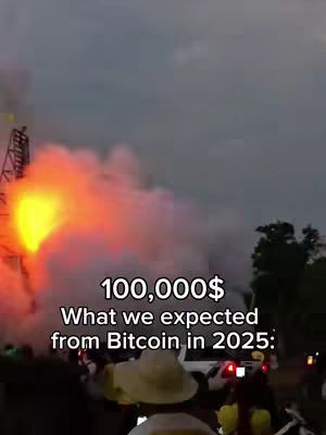 The image shows a nighttime scene possibly at a festival or event, with a dramatic display of fiery colors, likely from a fireworks or pyrotechnics show. In the foreground, there are obscured figures and objects, with focus on the vibrant display of flames and smoke above. Text overlayed on the scene displays the expectation of Bitcoin's value in 2025.